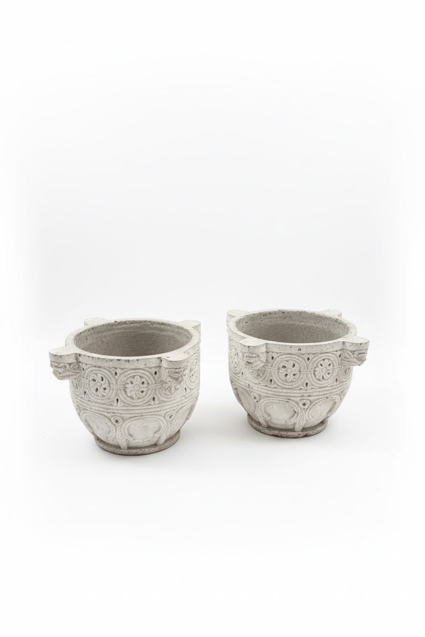 Pair of vintage concrete planters to resemble antique ivory store